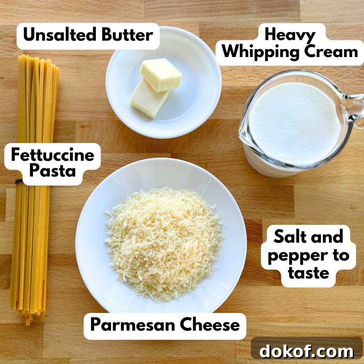 Ingredients to make fettucinne alfredo: fettuccine pasta, Parmesan cheese, heavy whipping cream, and, butter.