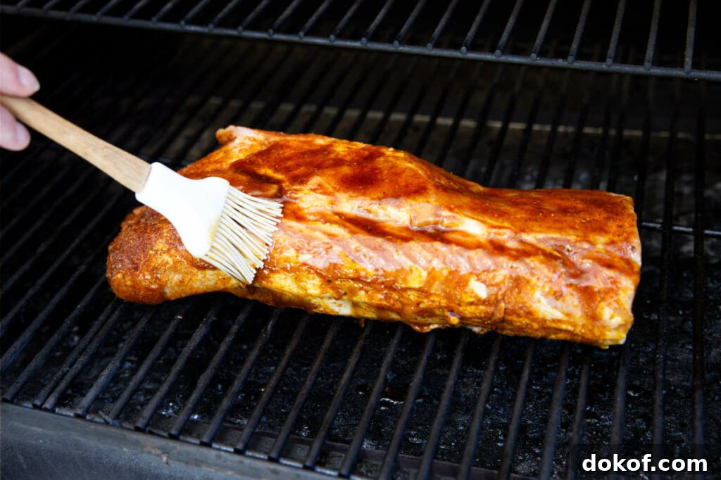 brushing the glaze on the pork loin