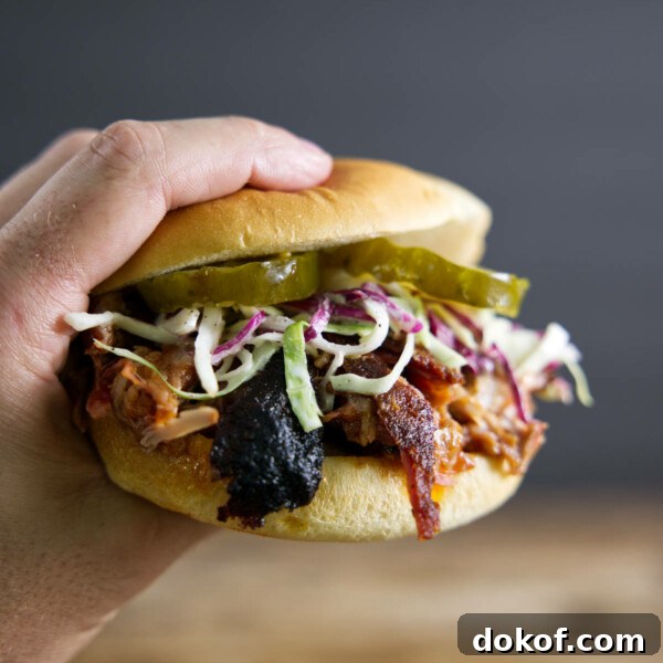 Pulled pork sandwich made from smoked pork butt