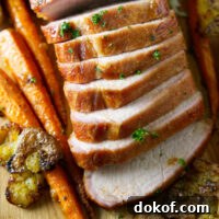 sliced whole smoked pork loin on cutting board