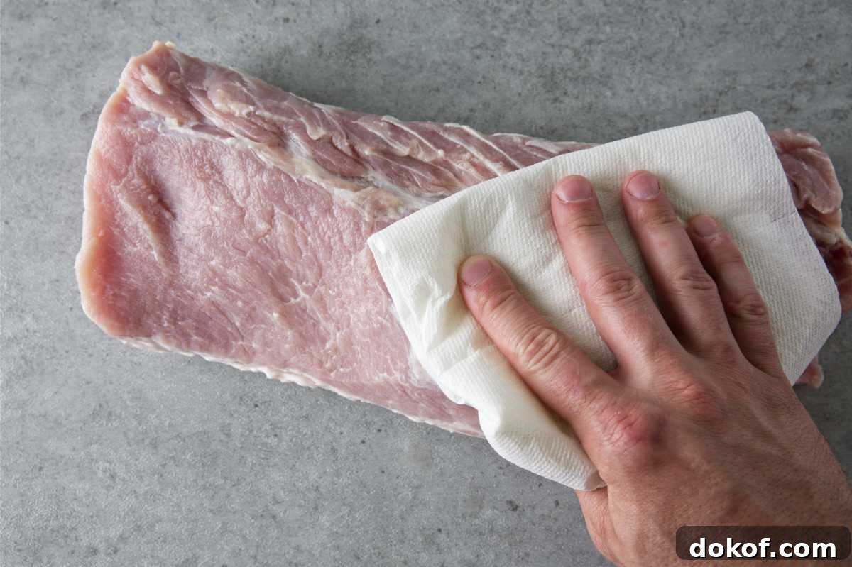 patting dry a pork loin