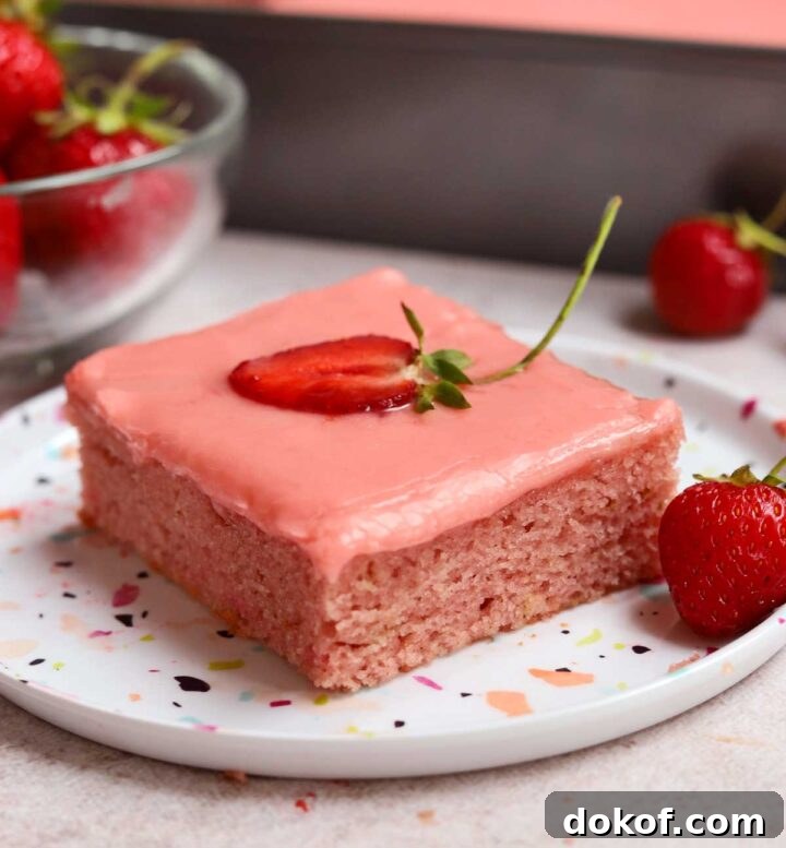 Fresh Strawberry Sheet Cake Recipe — Moist, Fruity Dessert 2 slice of strawberry sheet cake on a plate with fresh strawberries