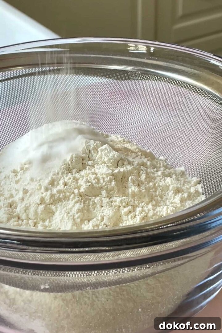 Fresh Strawberry Sheet Cake Recipe — Moist, Fruity Dessert 10 Sift flour, sugar, baking powder and salt into a large bowl and whisk to combine.