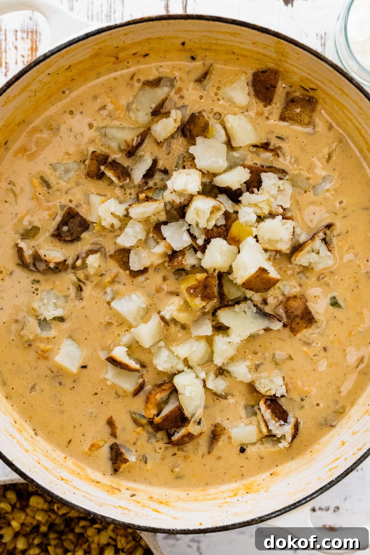 how to make potato corn chowder recipe step-by-step: cut the potatoes and add them to the soup.