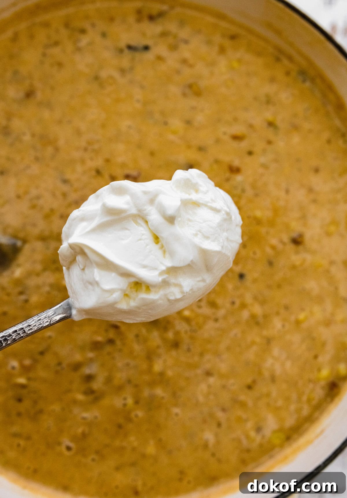 how to make potato corn chowder recipe step-by-step: add the sour cream to the soup.