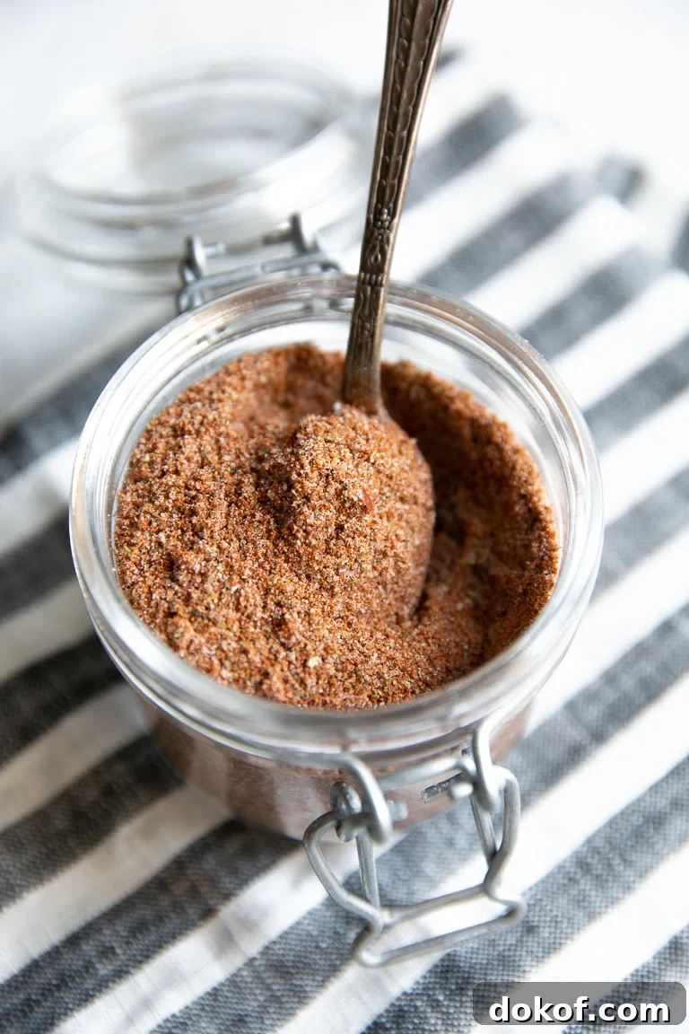Glass jar filled with homemade taco seasoning.