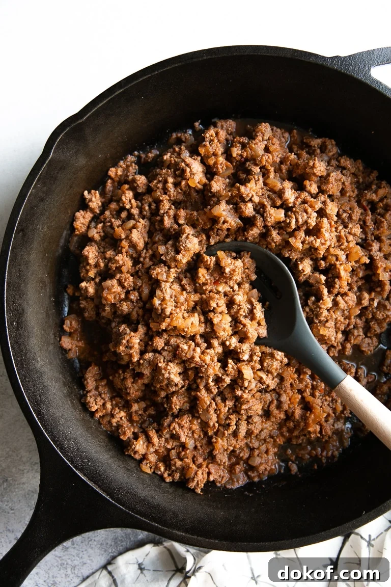 Cast Iron Skillet filled with ground beef taco meat.