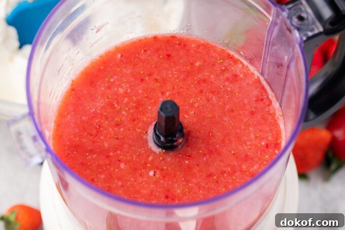 Strawberry puree in a blender.