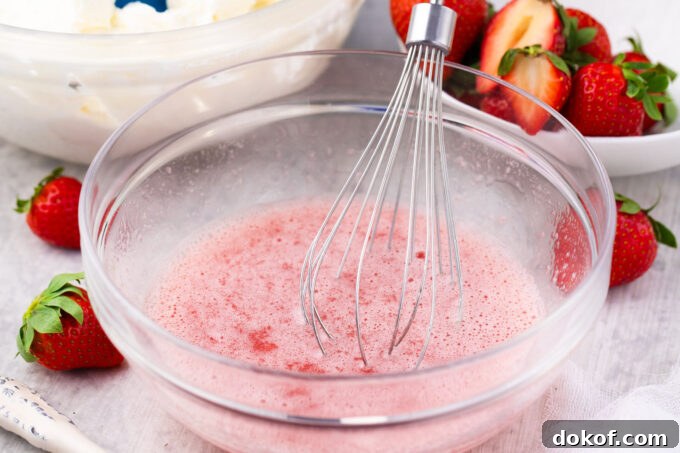 Mixing gelatin into strawberry puree.