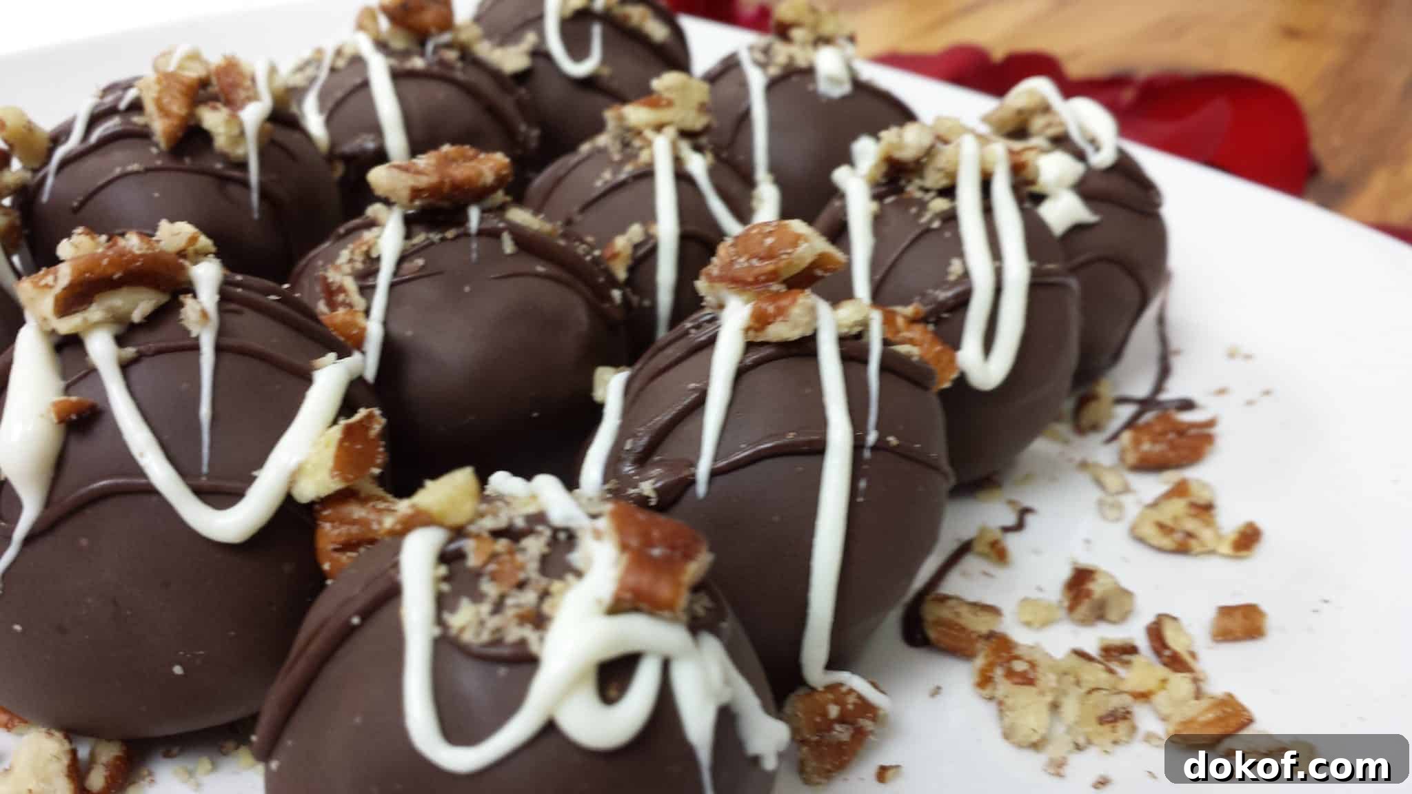 Pecan Fudge Brownie Truffles topped with crushed pecans.