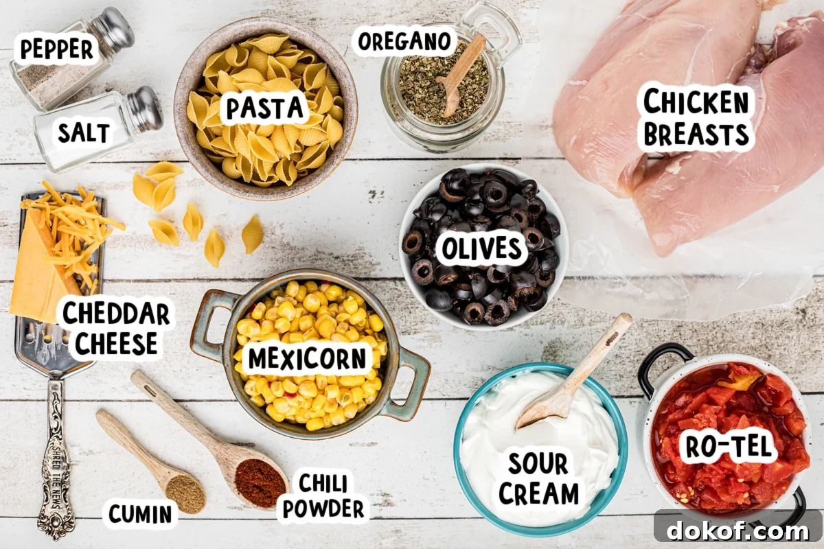 Southwestern Cheesy Chicken Pasta Bake with Roasted Corn and Peppers 3 ingredients for slow cooker southwestern cheesy chicken pasta on a table.