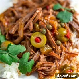 Authentic Cuban Ropa Vieja Recipe: Classic Shredded Beef Stew 9 A plate of cuban ropa vieja