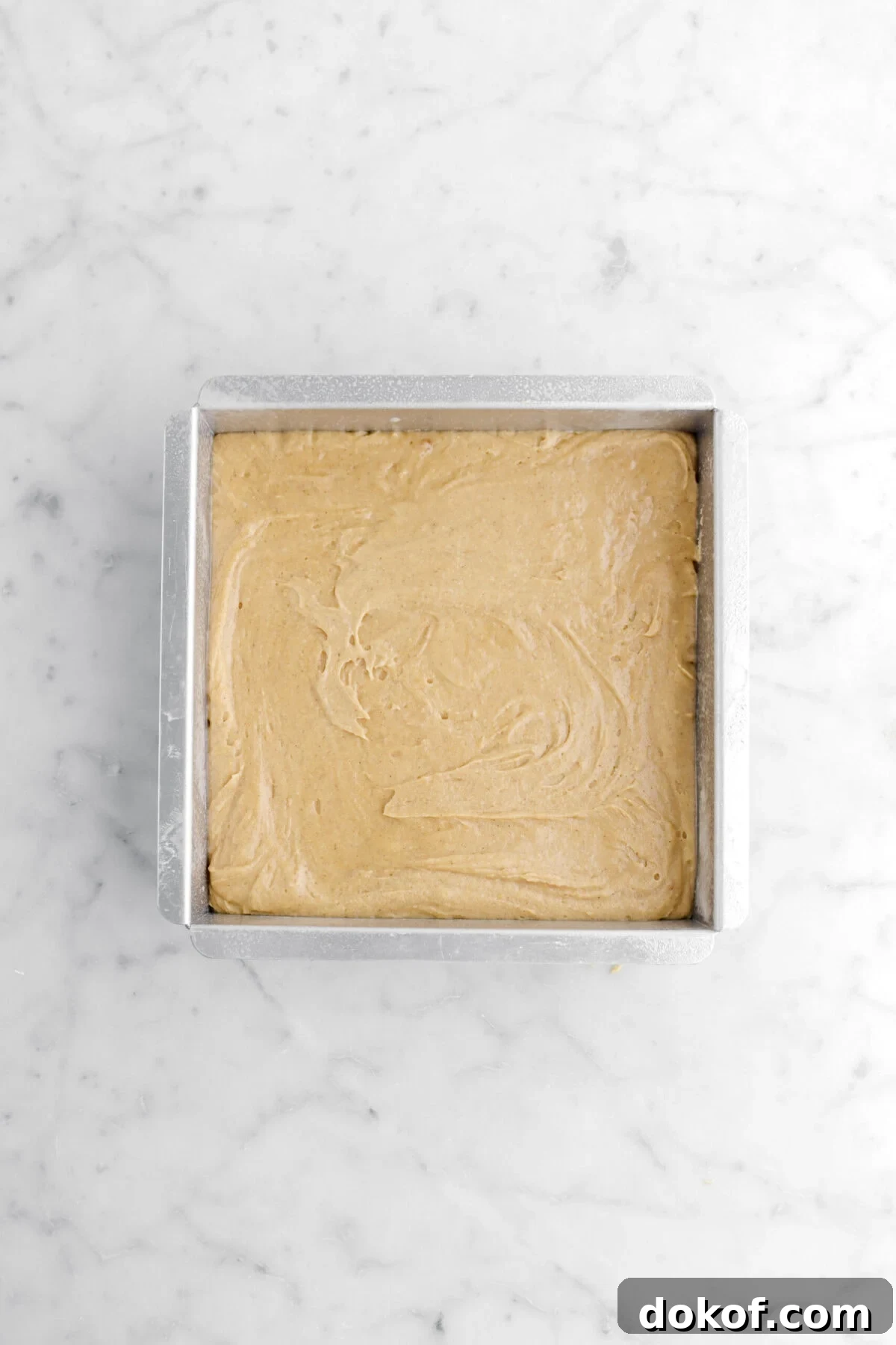 blondie batter in square pan.