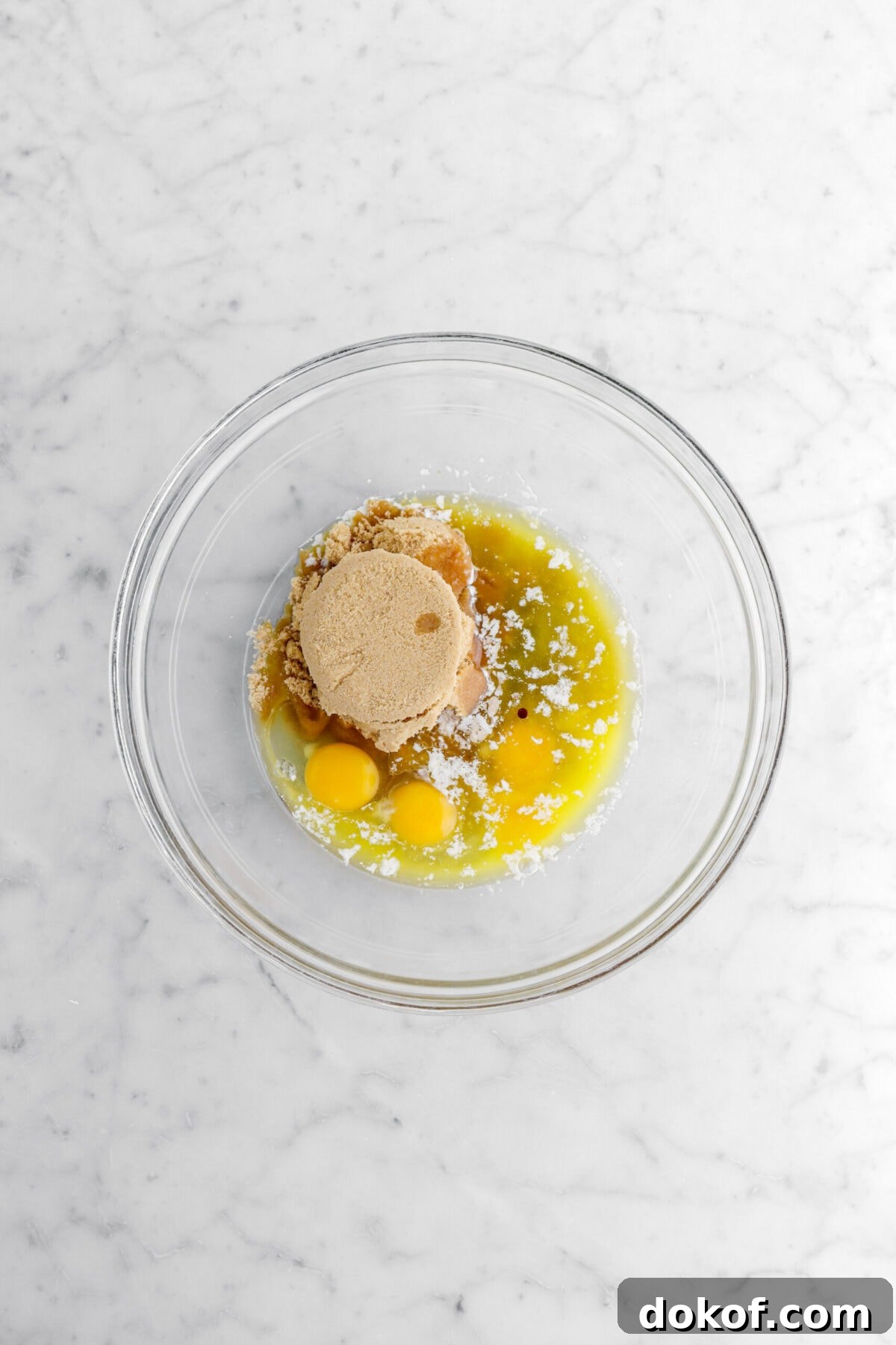 brown sugar, eggs, melted butter, and vanilla in glass bowl.