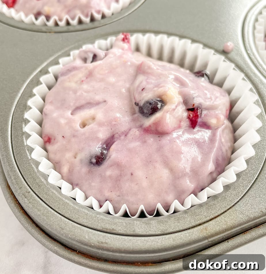 Scoop muffin batter into muffin cavities