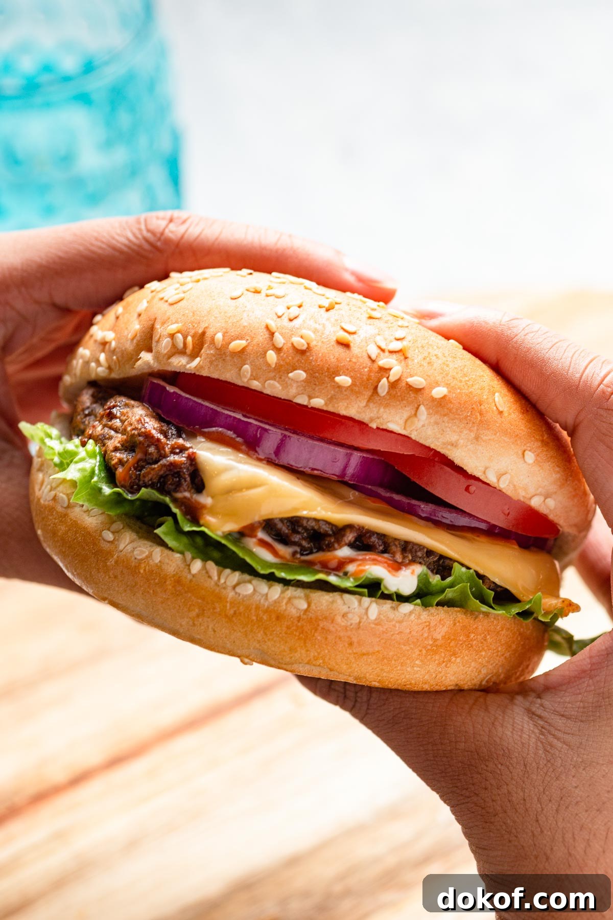 frozen hamburgers in the air fryer with a glass of pop