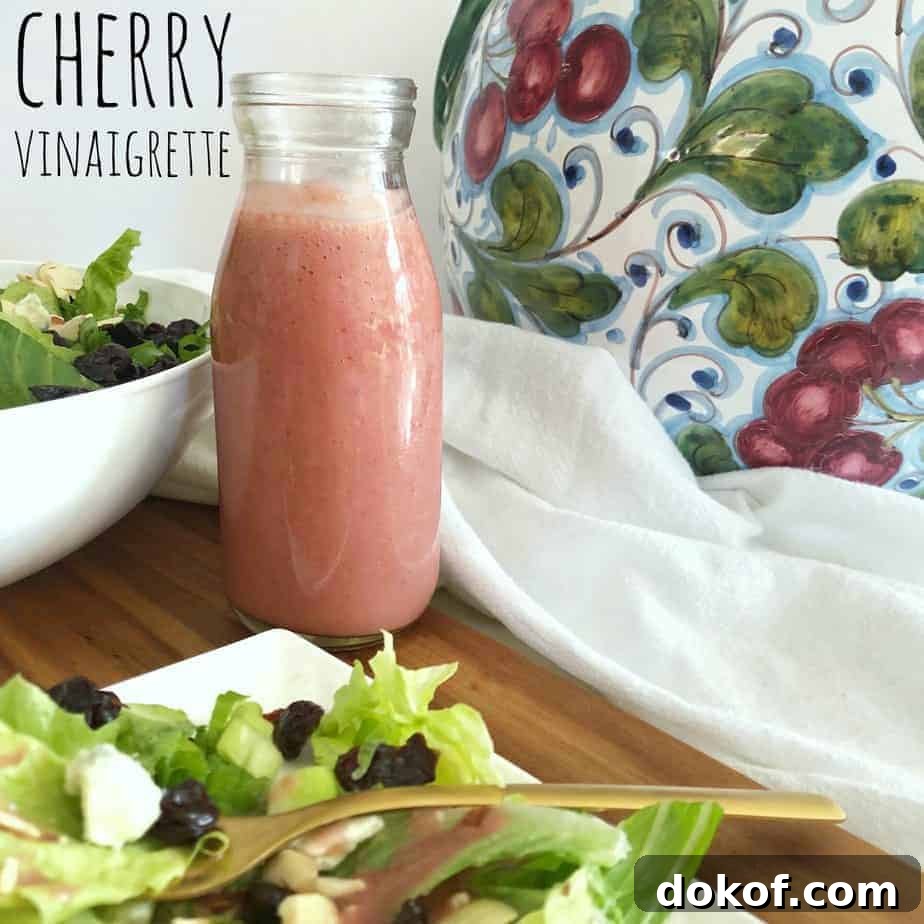 Cherry Vinaigrette Recipe: Tangy Salad Dressing with Fresh Cherries 2 pink bottle of cherry vinaigrette with salad