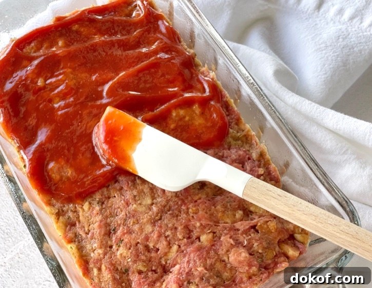 Easy meatloaf recipe topped with ketchup. 