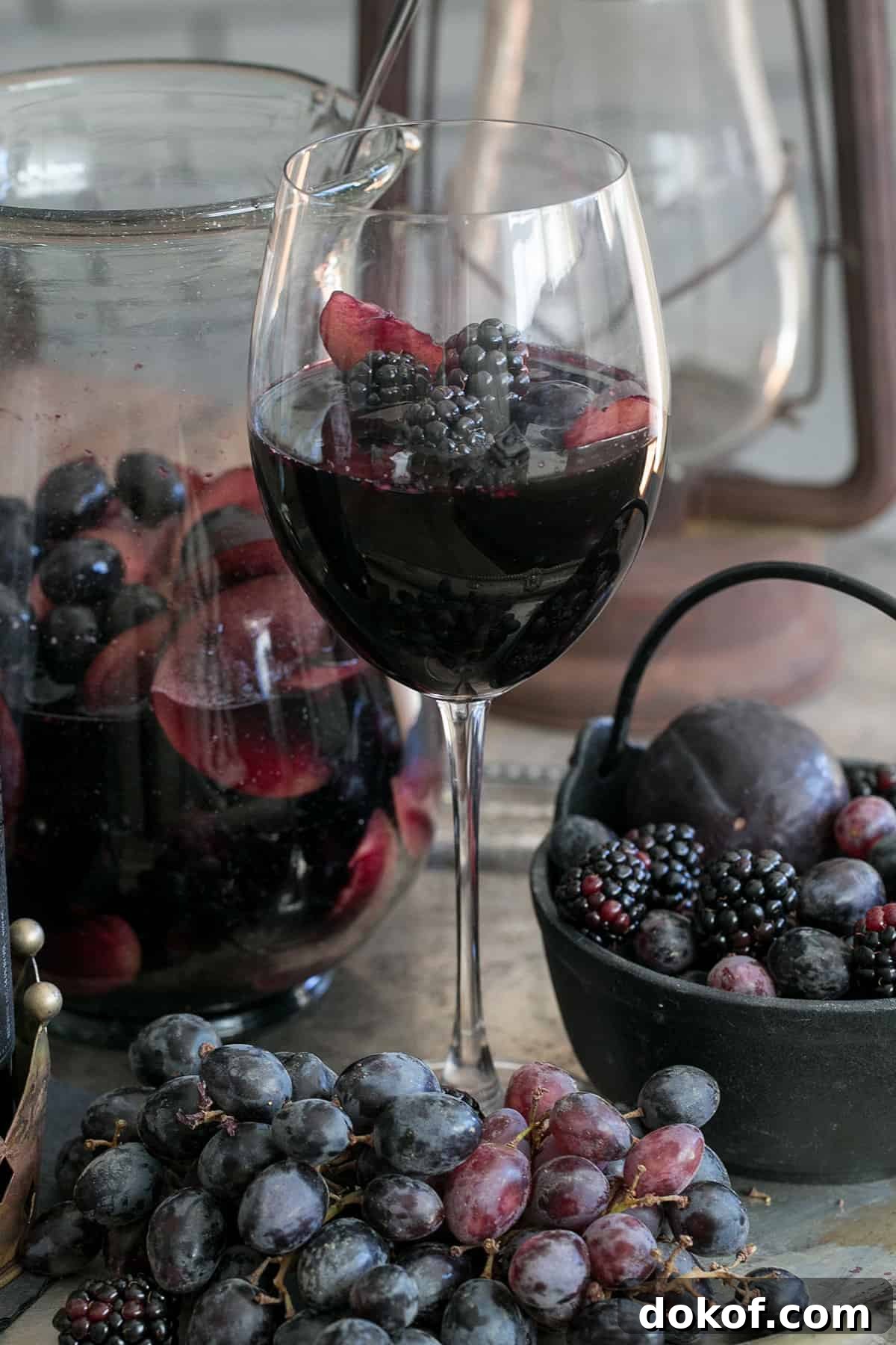 Black sangria in a wine glass for Halloween.