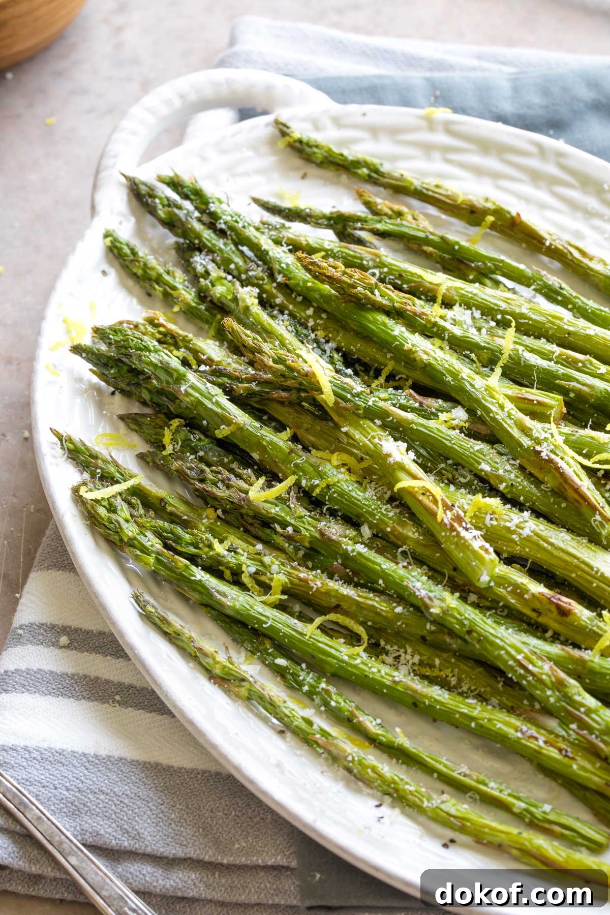 Air fried asparagus served with parmesan and lemon zest.