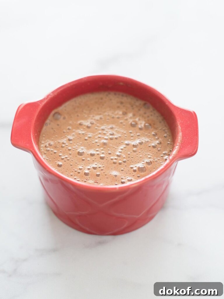 Quick Microwave Chocolate Mug Cake Recipe in 2 Minutes 13 all ingredients for mug cake mixed together