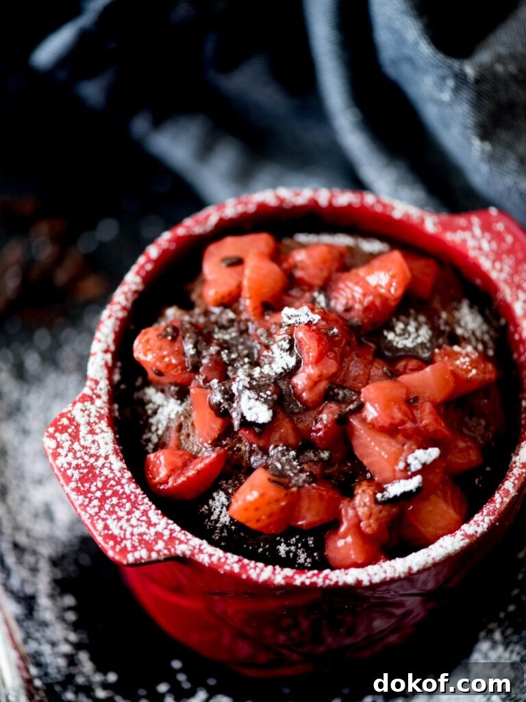 Quick Microwave Chocolate Mug Cake Recipe in 2 Minutes 15 Chocolate Mug Cake with Sweet Strawberry Topping and powdered sugar