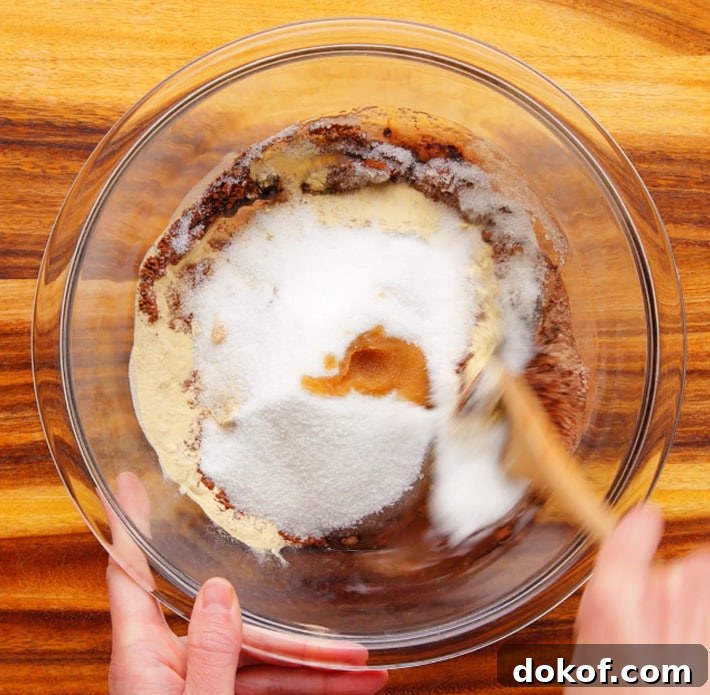 Stirring Brownie Ingredients In A Bowl with a spoon