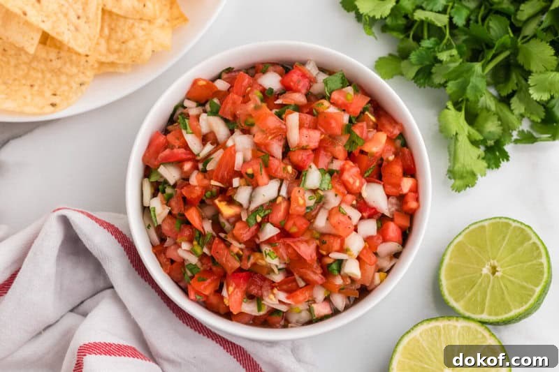 Authentic Pico de Gallo Recipe: Fresh Mexican Salsa Tutorial 3 Pico de Gallo served in a white bowl with tortilla chips.