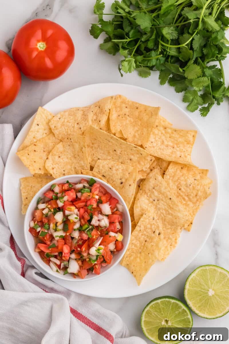 Authentic Pico de Gallo Recipe: Fresh Mexican Salsa Tutorial 9 top-down view of the Pico de Gallo with tortilla chips.