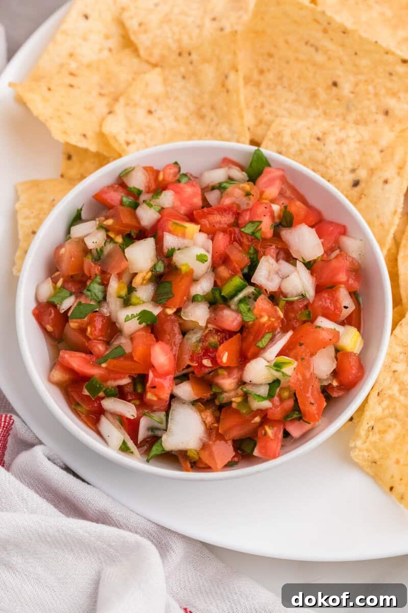 Authentic Pico de Gallo Recipe: Fresh Mexican Salsa Tutorial 10 closeup of a white bowl of the Pico de Gallo.