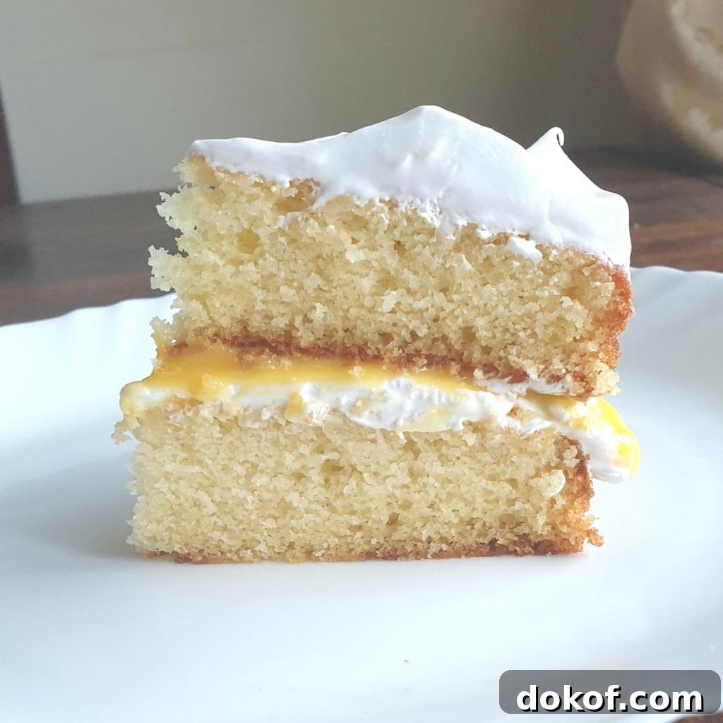 Slice of white cake with passionfruit curd