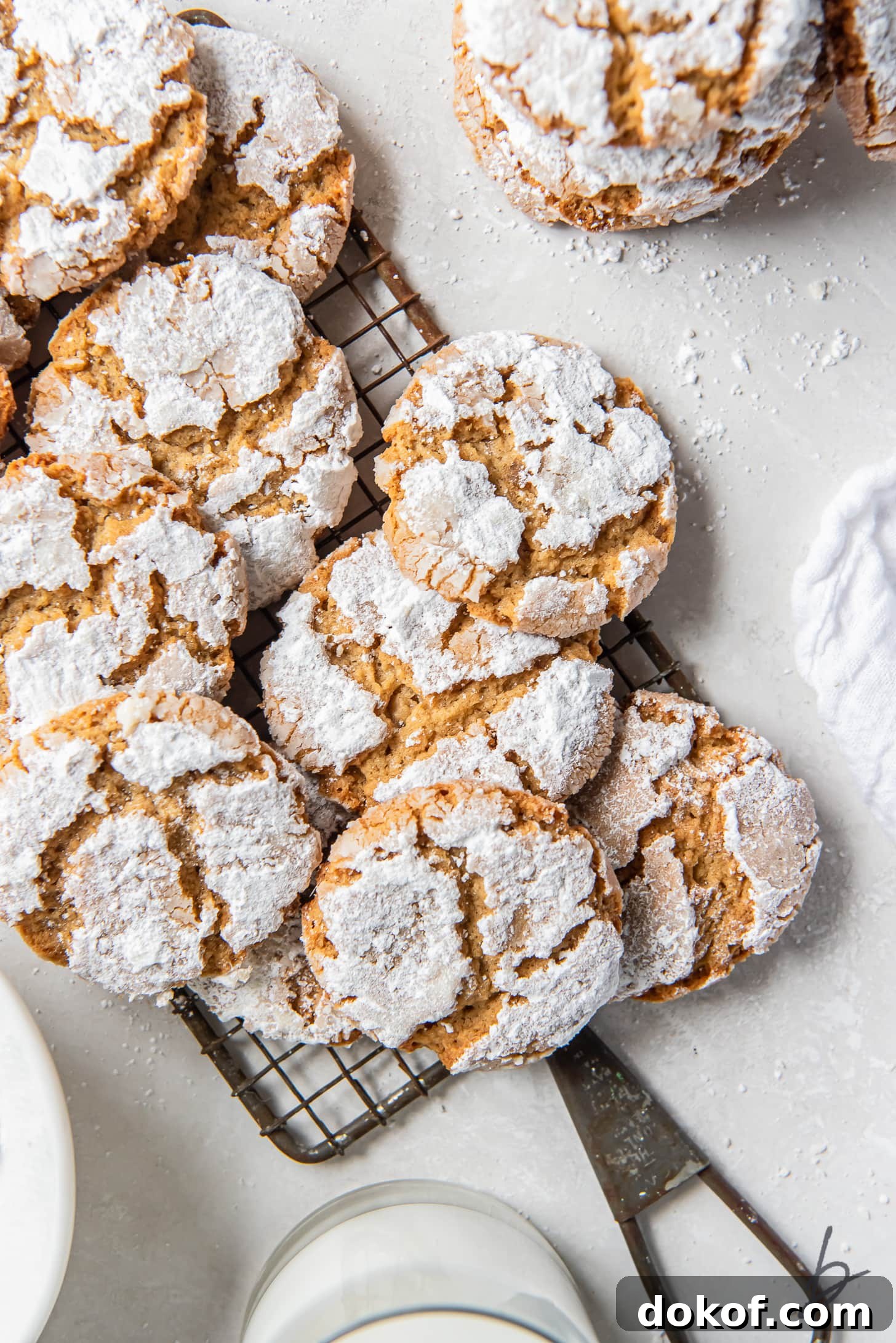 peanut butter crinkle cookies on small antique wire rack with handle