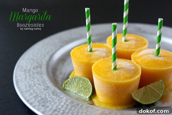 This delicious mango margarita boozesicle takes your favorite cocktail and turn it into a boozy summertime treat. Hello boozesicles!