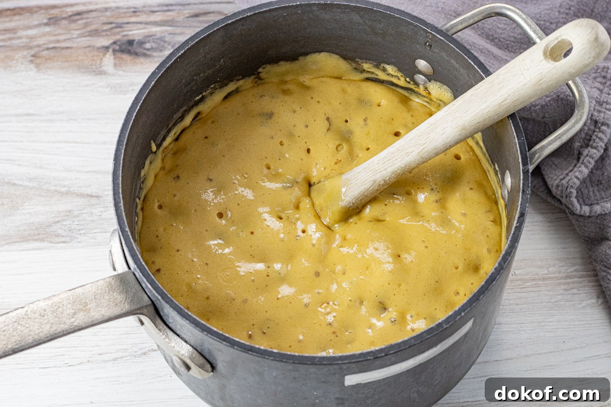 bubbly, golden peanut candy in a large pot