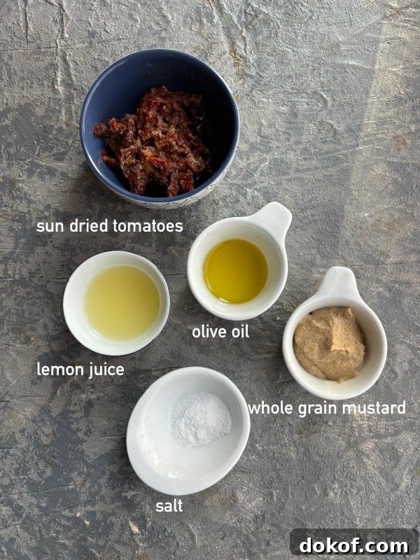 overhead image of the ingredients needed to make sun dried tomato dressing.