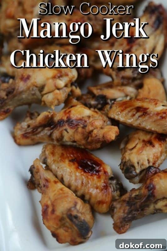 Slow Cooker Mango Jerk Chicken Wings on a white platter