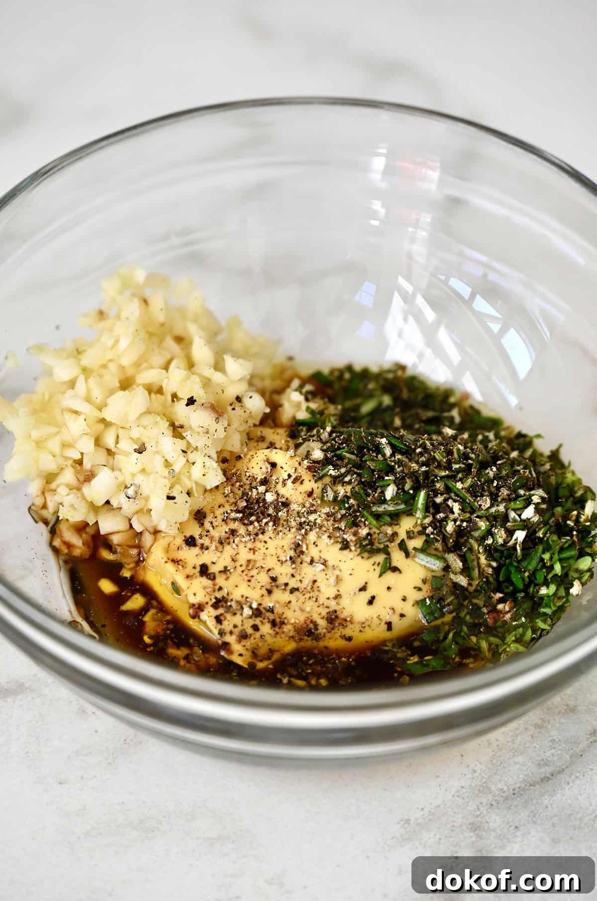 Wet rub for pork loin in a glass bowl.