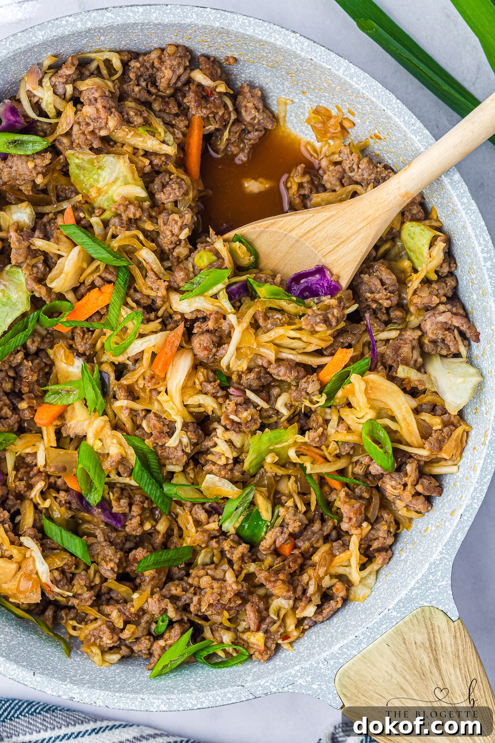 Egg Roll in a Bowl is a delicious deconstructed take on traditional egg rolls, featuring hearty ground sausage stir-fried with vegetables.