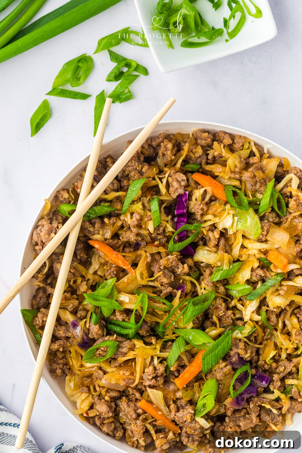 Egg Roll in a Bowl is a delicious deconstructed take on traditional egg rolls, featuring hearty ground sausage stir-fried with vegetables.