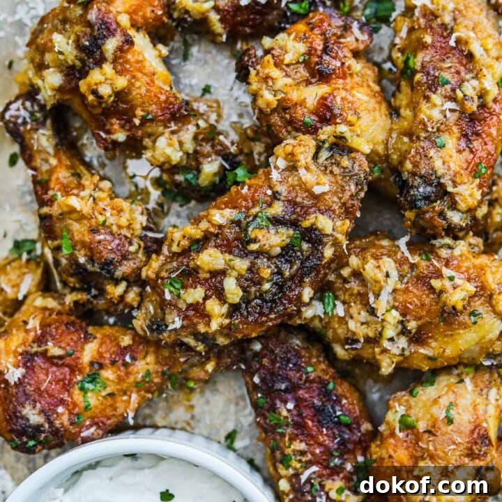 Garlic parmesan wings covered in garlic and parsley served with a creamy dipping sauce.