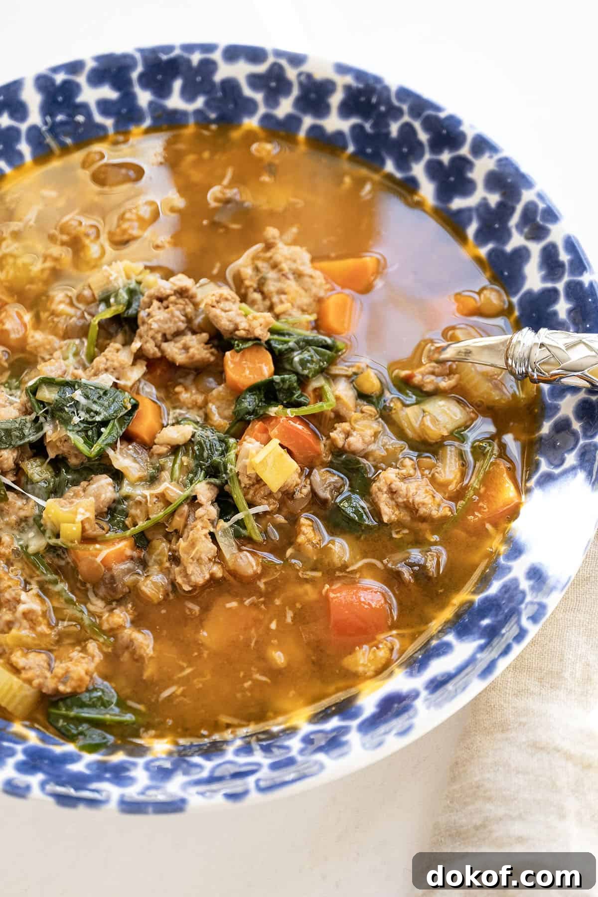Bowl of sausage and lentil soup.