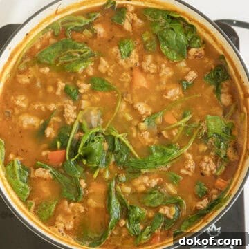 Spinach wilting in the soup.
