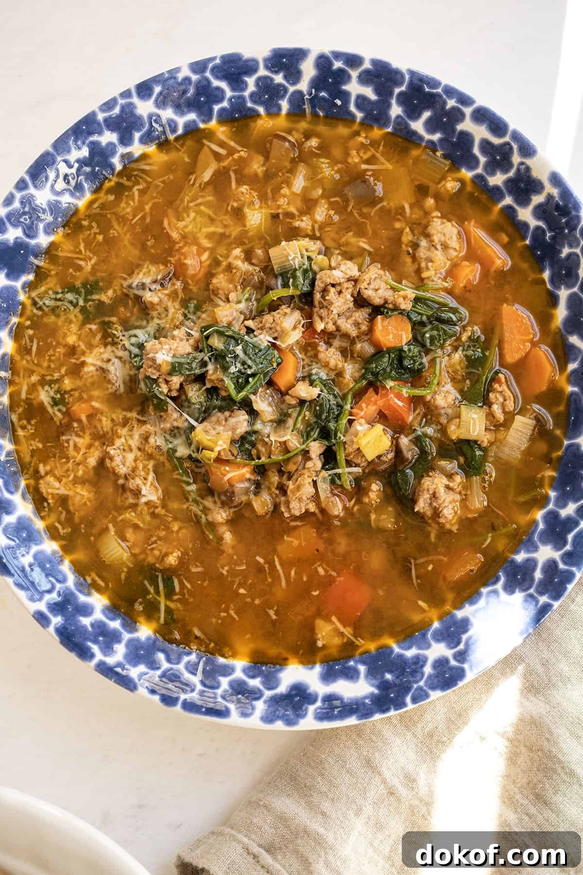 Bowl of sausage and lentil soup.