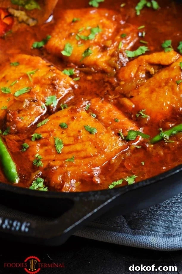 Indian Salmon curry cooked with Salmon fillet in a red sauce