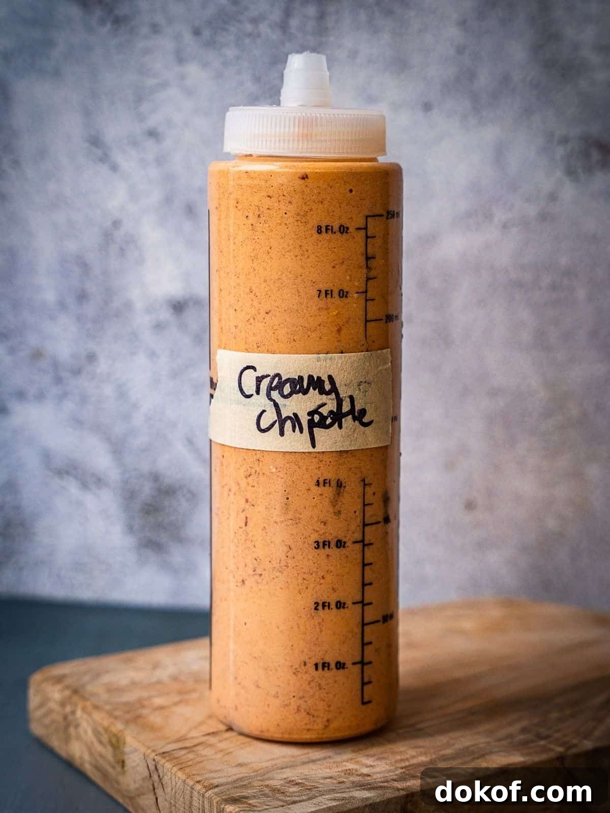 A squeeze bottle filled with sauce. 