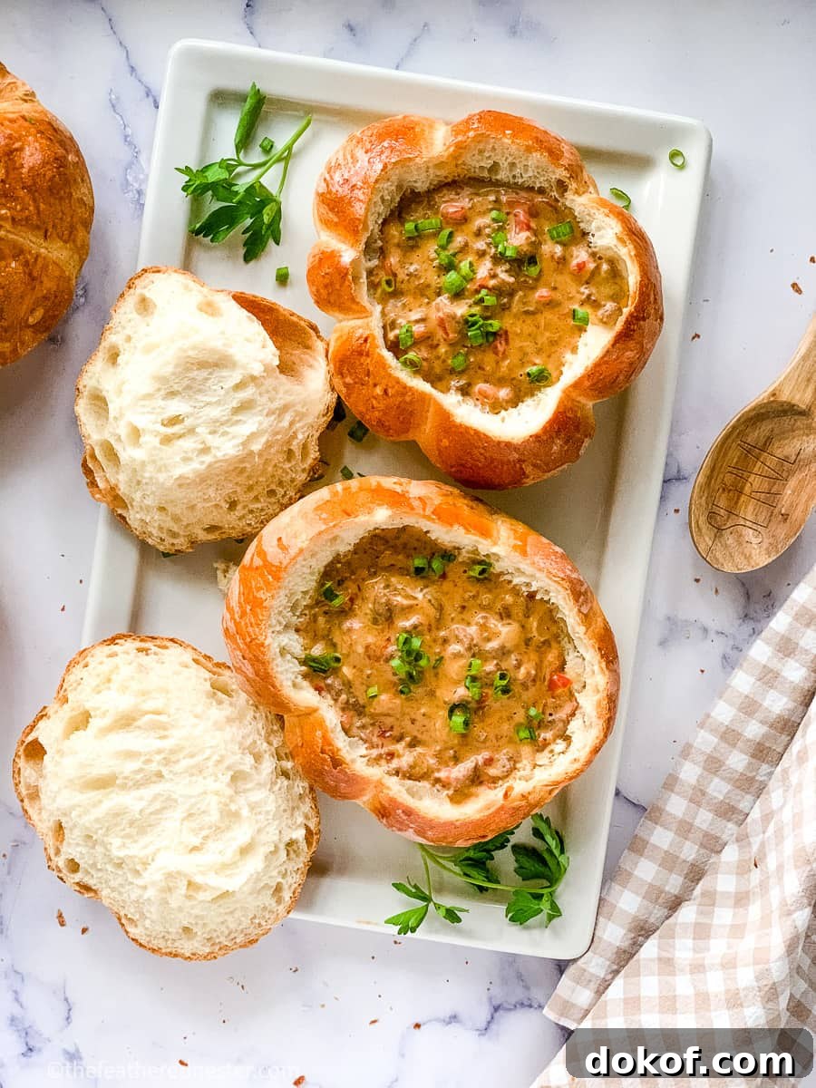 a serving platter containing bread bowl filled with cheeseburger soup recipe