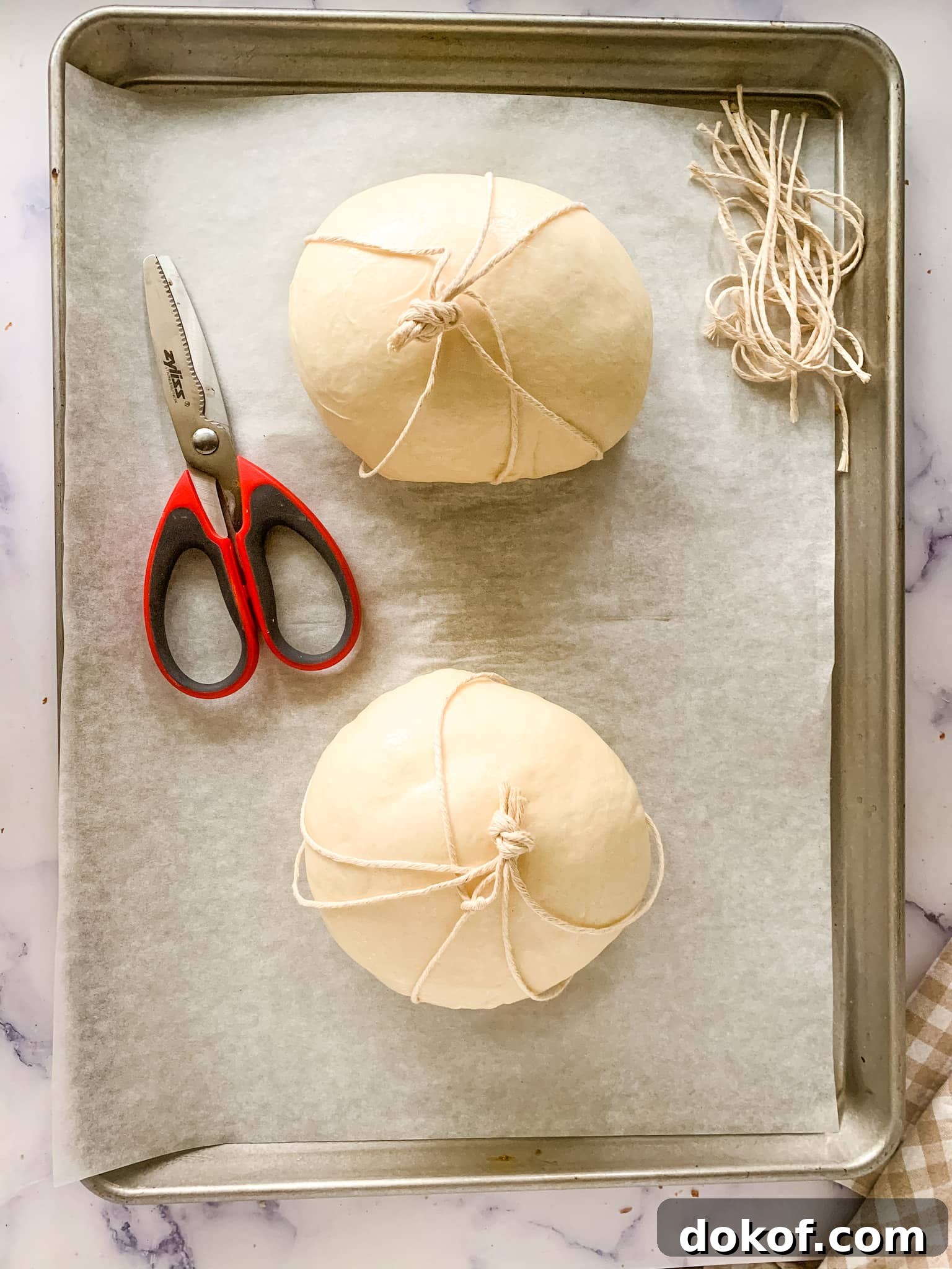 pumpkin bread bowl on a sheet pan ready to be baked