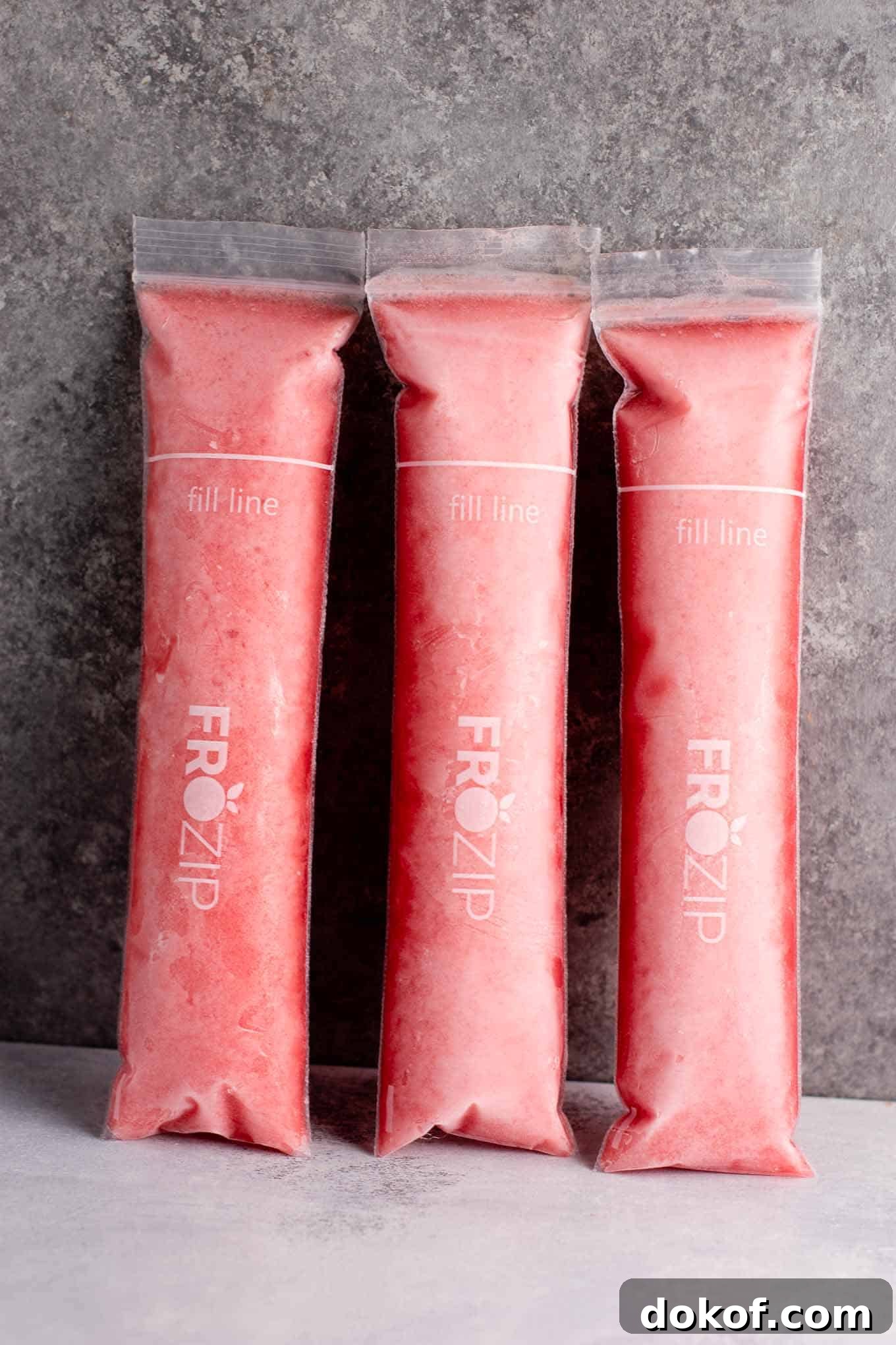Strawberry pineapple freezer pops – blended mixture poured into bags