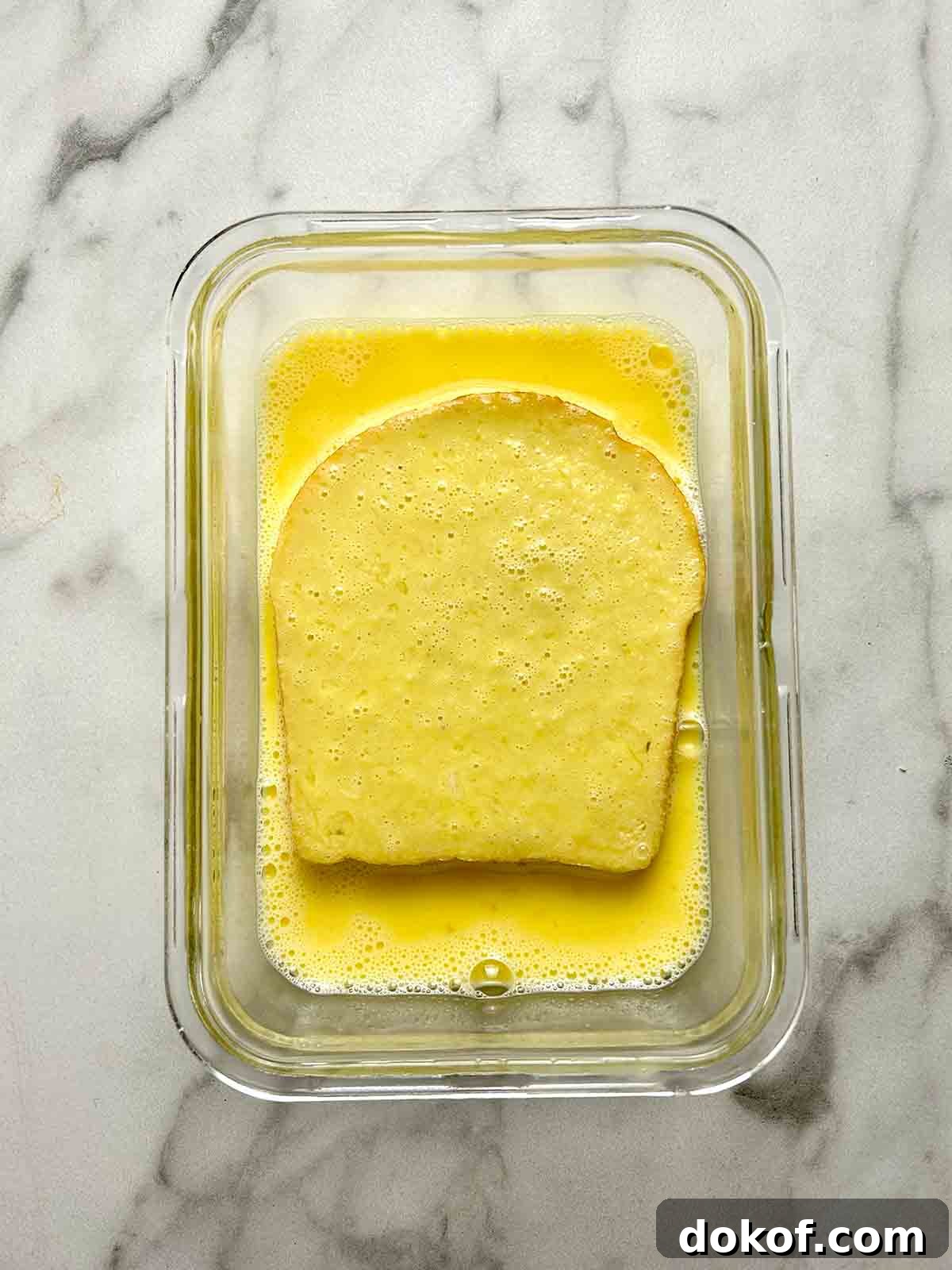 dipping other side of bread in egg mixture