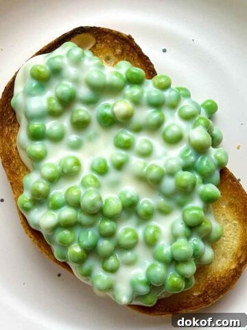 overhead shot of creamed peas on toast